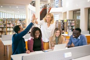 Happy employees illustrating the importance of Building a Mental Well-being Company Culture