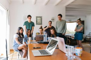 On image there is a group of people who are watching something, that one leader is showing them - an illustration for progressive leadership.