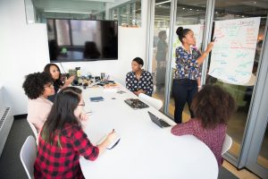 Meeting at work - workers discuss customer journey